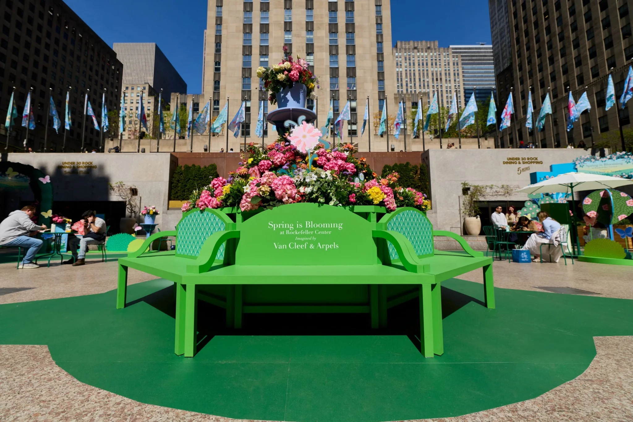 Van Cleef & Arpels Spring Is Blooming 2026 floral bench and installation at Rockefeller Center